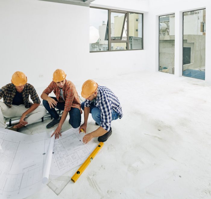 Builders checking blueprints