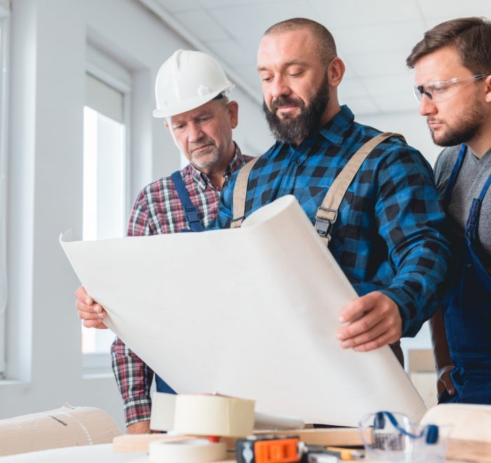 Builders looking at the blueprint