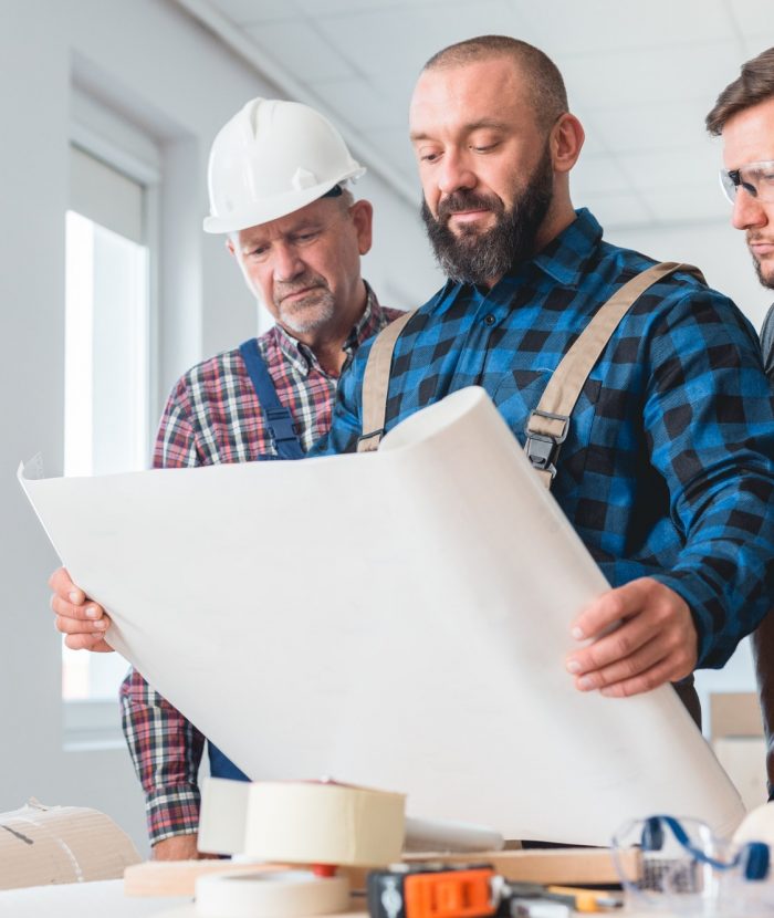 Builders looking at the blueprint